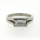 18ct white gold ring set with a baguette cut diamond