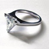 Platinum ring set with a trillian cut diamond